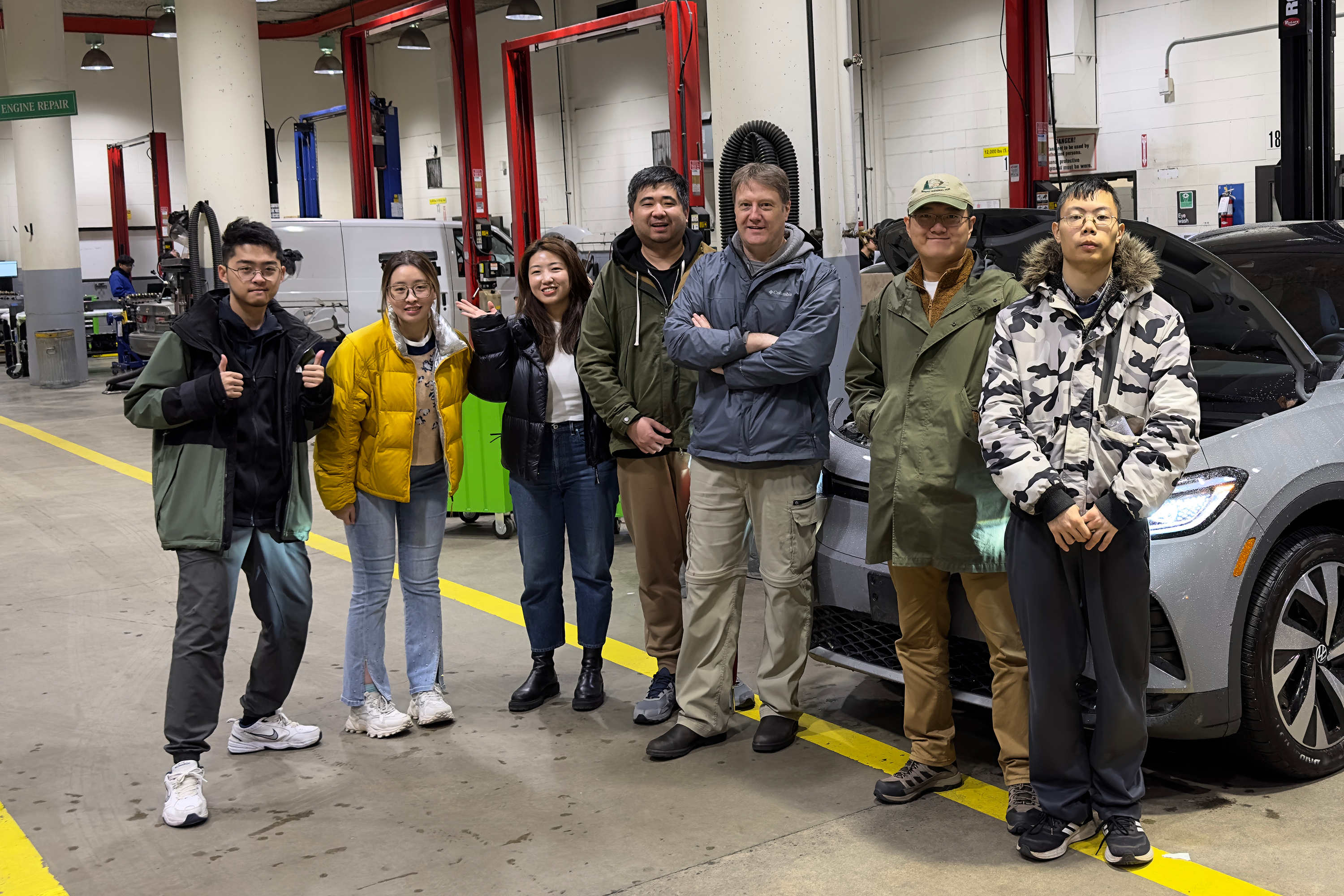 Volcrafter team standing in automotive shop