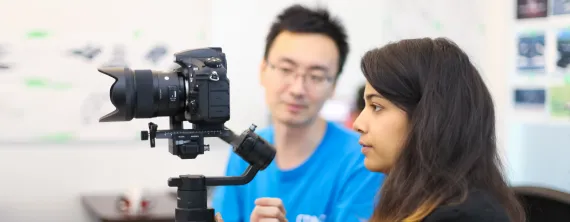 woman holding camera on stabilizer