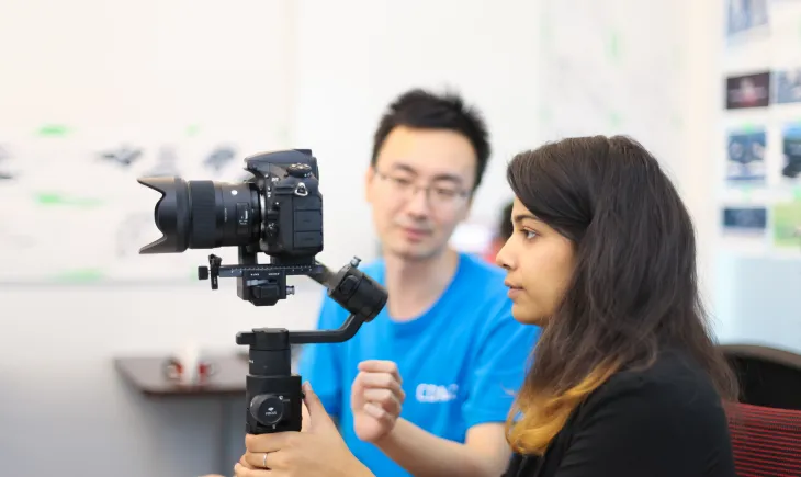 woman holding camera on stabilizer