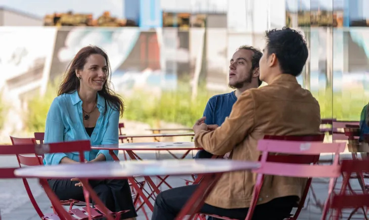 Students sitting on chairs outdoors