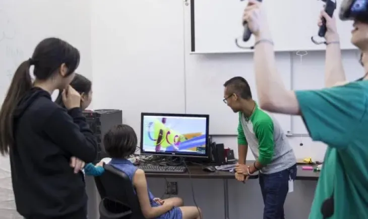 Students playing with a VR headset
