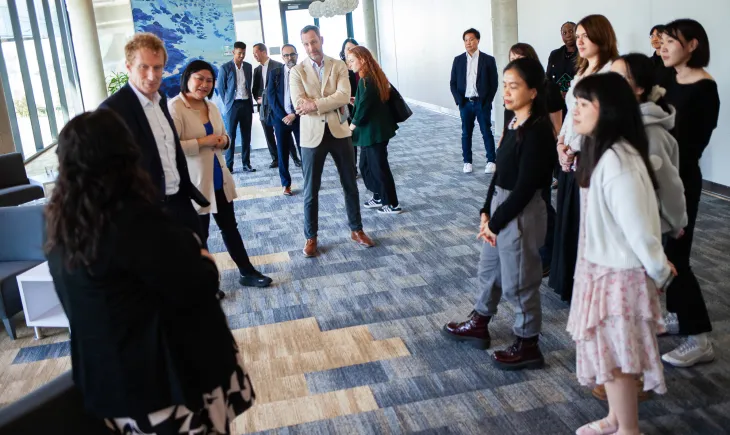 Minister talking with students