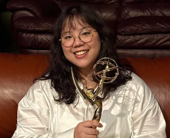 Meghan Ang holding Emmy