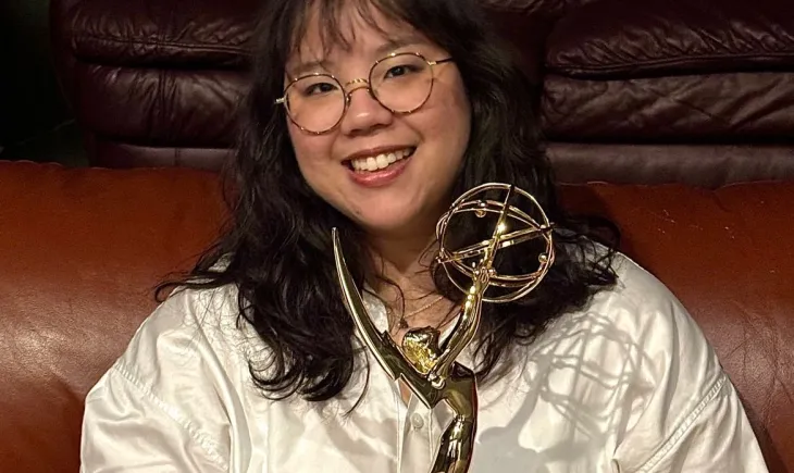 Meghan Ang holding Emmy